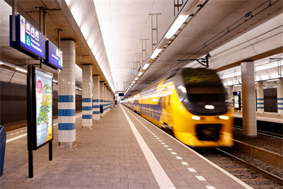Dutch NS train passing through Rijswijk station. Nederlandse Spoorwegen. 